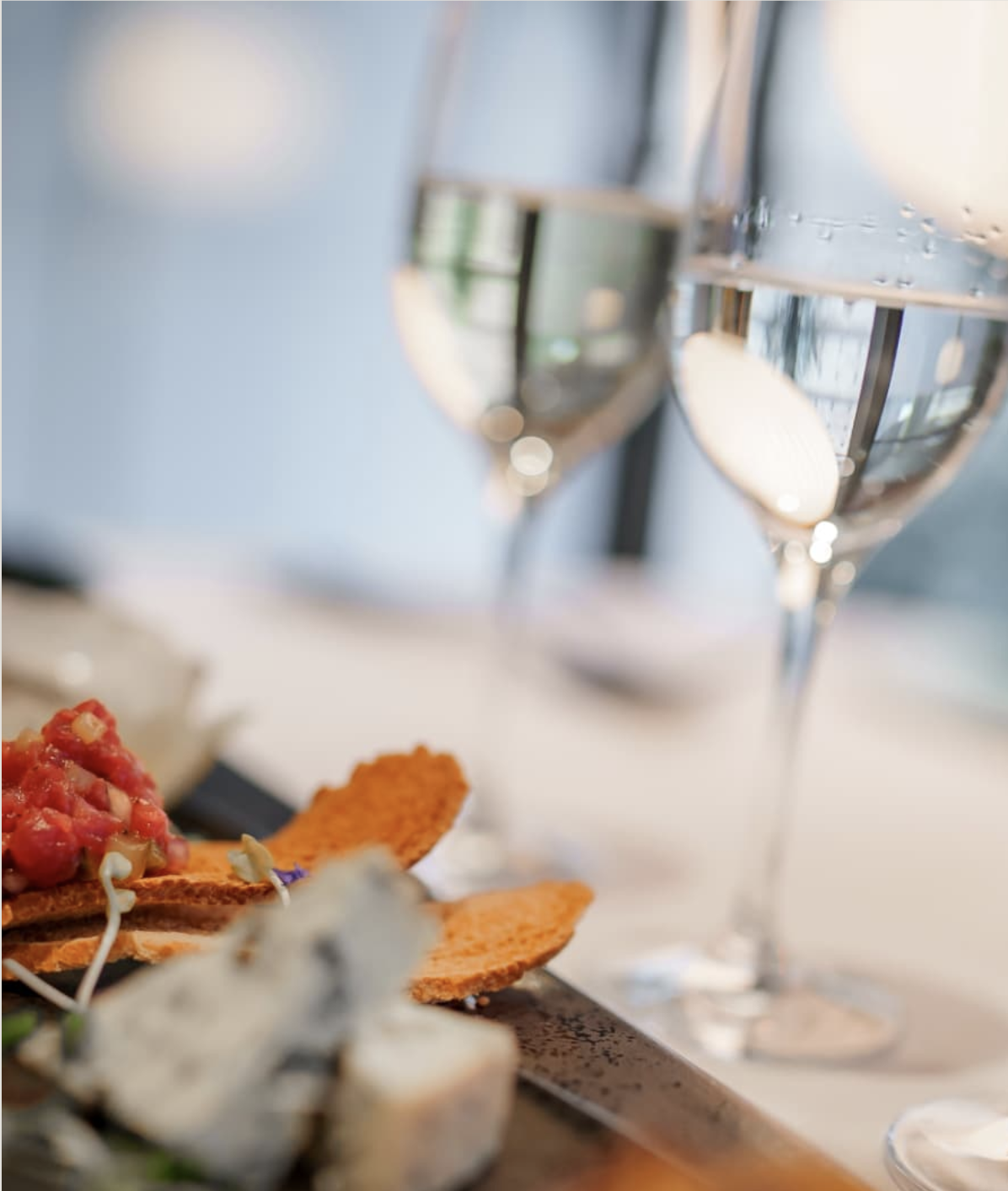 Appetizers and wine glasses on the table at a wine dinner